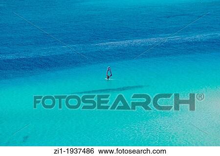 blue sea with windsurfer at Spiaggia, Sardinia View Large Photo Image Stock Photograph - blue sea with windsurfer at Spiaggia, Sardinia. Fotosearch