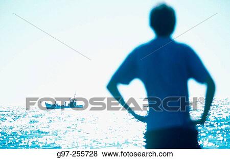 Blue silhouette and boat View Large Photo Image Stock Photo - Blue silhouette and boat. Fotosearch