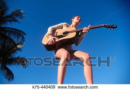 Blue sky, guitar View Large Photo Image Stock Photo - Blue sky, guitar. Fotosearch
