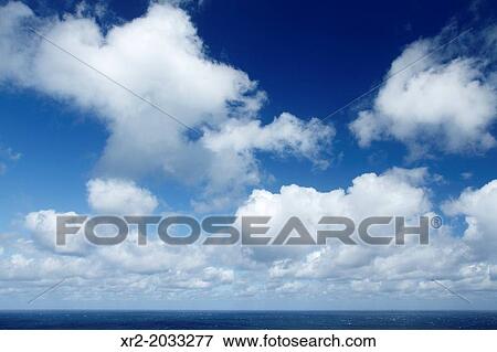 Blue sky with some clouds over the sea in Malta. View Large Photo Image Stock Photo - Blue sky with some clouds over the sea in Malta.. Fotosearch