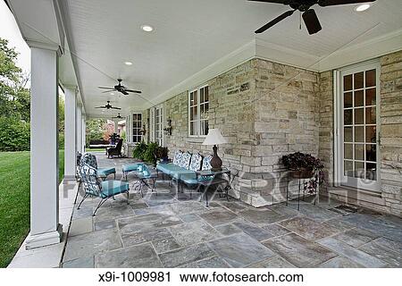 Bluestone patio with columns and blue furniture View Large Photo Image Stock Image - Bluestone patio with columns and blue furniture. Fotosearch