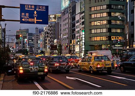 Blur of taxis at dusk in Omotesando, Tokyo, Japan. View Large Photo Image Stock Photograph - Blur of taxis at dusk in Omotesando, Tokyo, Japan.. Fotosearch