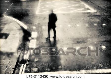 Blured silhouette of a man crossing a street in London, England, UK, Europe. View Large Photo Image Stock Image - Blured silhouette of a man crossing a street in London, England, UK, Europe.. Fotosearch