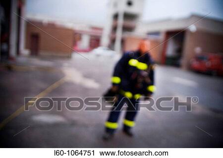 Stock Image - Blurred Fireman. Fotosearch