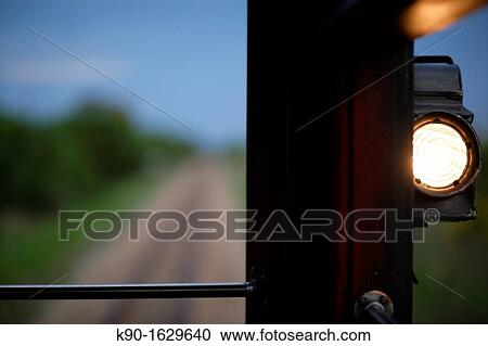 Blurred straight train tracks through the green African savannah with a burning positioning lamp of the train waggon, Botswana, Southern Africa View Large Photo Image Stock Image - Blurred straight train tracks through the green African savannah with a burning positioning lamp of the train waggon, Botswana, Southern Africa. Fotosearch
