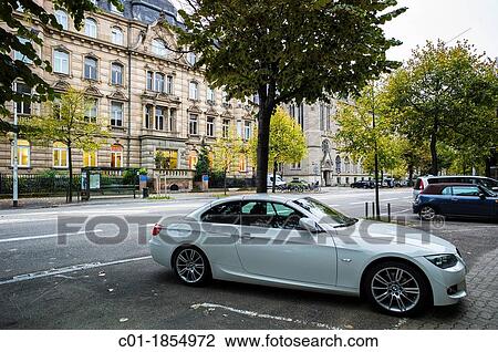 BMW car parked on pavement Strasbourg Alsace France View Large Photo Image Stock Image - BMW car parked on pavement Strasbourg Alsace France. Fotosearch