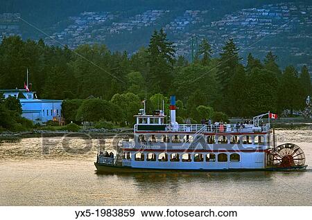Boat carrying tourists in Coal Harbour, Vancouver, BC. View Large Photo Image Stock Photo - Boat carrying tourists in Coal Harbour, Vancouver, BC.. Fotosearch
