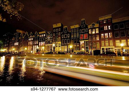 Boat crossing the channel in Amsterdam, Northern Holland, Holland View Large Photo Image Stock Photo - Boat crossing the channel in Amsterdam, Northern Holland, Holland. Fotosearch