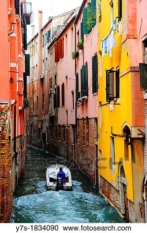 Boat in a small canal in Venice, Italy, Europe View Large Photo Image Stock Image - Boat in a small canal in Venice, Italy, Europe. Fotosearch