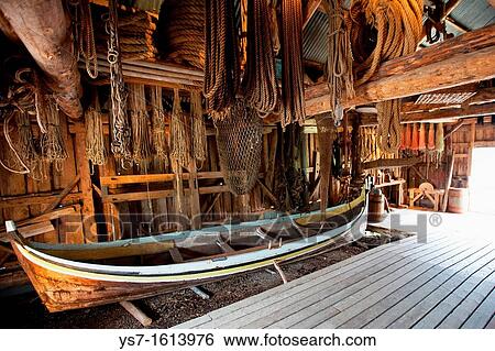 Boat in a warehouse in the Nusfjord village, Flakstadoya island, Lofoten archipelago, Norway, Europe View Large Photo Image Stock Photograph - Boat in a warehouse in the Nusfjord village, Flakstadoya island, Lofoten archipelago, Norway, Europe. Fotosearch