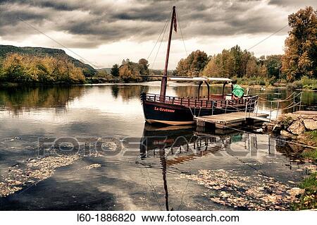 Stock Image - Boat in Beynac-et-Cazenac, Perigord noir, France. Fotosearch