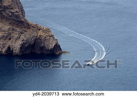 Boat near to Cap de Formentor, Mallorca, Balearic Islands, Spain. View Large Photo Image Stock Image - Boat near to Cap de Formentor, Mallorca, Balearic Islands, Spain.. Fotosearch