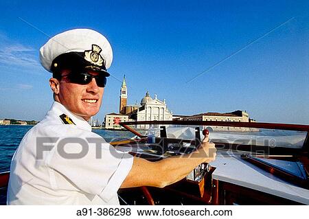 Boat pilot. Hotel Cipriani Riva passing by the San Georgio island on his way to Giudecca island. Venice. Venetia. Italy View Large Photo Image Stock Photo - Boat pilot. Hotel Cipriani Riva passing by the San Georgio island on his way to Giudecca island. Venice. Venetia. Italy. Fotosearch