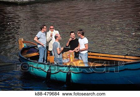 Picture - Boating in city canals. Amsterdam, Netherlands.. Fotosearch