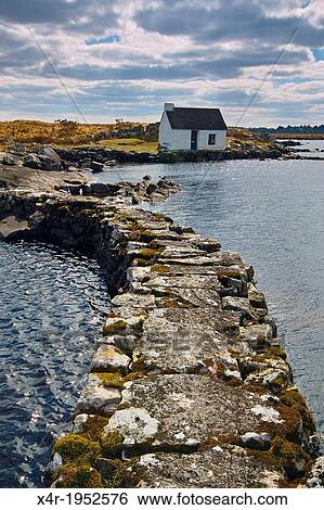 Stock Photograph - Boatkeepers office at the shore of a small lake in Connemara, near Maams Cross, County Galway, Ireland.. Fotosearch