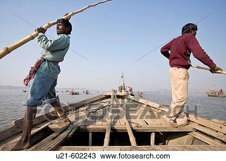 Boatmen transporting pilgrims to Sangam, the place where the Yamuna meets the Ganges, the holiest of places to take a bath. View Large Photo Image Stock Image - Boatmen transporting pilgrims to Sangam, the place where the Yamuna meets the Ganges, the holiest of places to take a bath.. Fotosearch