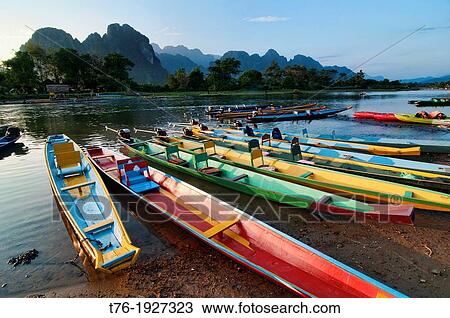 boats along the Nam Song River in Vang Vieng, Laos View Large Photo Image Stock Image - boats along the Nam Song River in Vang Vieng, Laos. Fotosearch