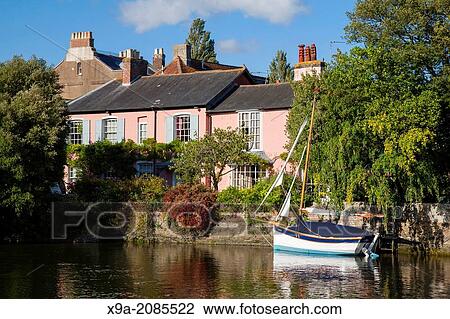 Boats and House on River Avon, Christchurch, Dorset, England, UK. View Large Photo Image Stock Image - Boats and House on River Avon, Christchurch, Dorset, England, UK.. Fotosearch