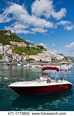 Boats in the harbour and a view of the town of Amalfi on the Gulf of Salerno in southern Italy View Large Photo Image Stock Image - Boats in the harbour and a view of the town of Amalfi on the Gulf of Salerno in southern Italy. Fotosearch