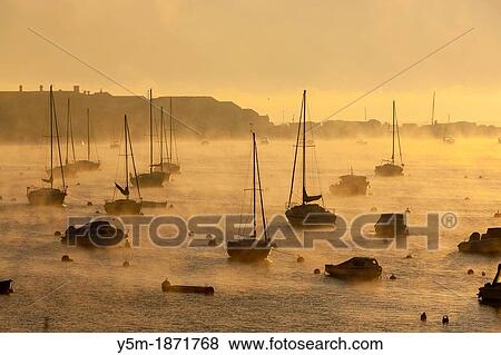 Boats moored on the Teign estuary in Teignmouth, South Devon, England, UK, Europe View Large Photo Image Stock Photo - Boats moored on the Teign estuary in Teignmouth, South Devon, England, UK, Europe. Fotosearch