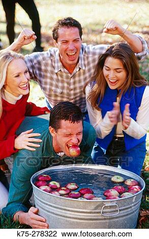 Bobbing for apples View Large Photo Image Stock Image - Bobbing for apples. Fotosearch