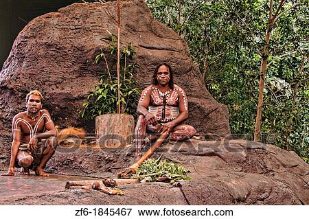 Stock Photo - Body Painted Tjappukai Aboriginal natives with Didgeeridoo in Cairns Australia Queensland. Fotosearch