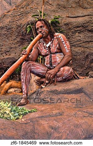 Body Painted Tjappukai Aboriginal native with Didgeeridoo in Cairns Australia Queensland View Large Photo Image Stock Photo - Body Painted Tjappukai Aboriginal native with Didgeeridoo in Cairns Australia Queensland. Fotosearch