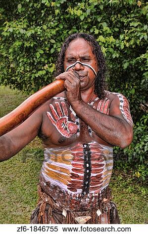Body Painted Tjappukai Aboriginal native with Didgeeridoo in Cairns Australia Queensland View Large Photo Image Stock Photography - Body Painted Tjappukai Aboriginal native with Didgeeridoo in Cairns Australia Queensland. Fotosearch