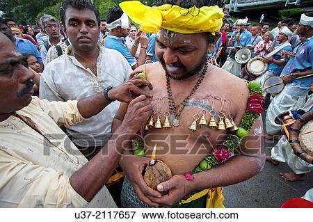 Body piercing at Thaipusam celebration in Kuching, Sarawak, Malaysia. View Large Photo Image Stock Photo - Body piercing at Thaipusam celebration in Kuching, Sarawak, Malaysia.. Fotosearch