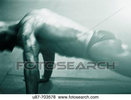 Stock Photo - Bodybuilder doing push ups. Fotosearch