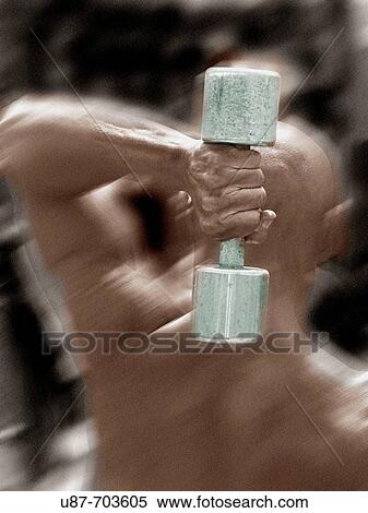 Bodybuilder exercising with dumbbell View Large Photo Image Stock Photography - Bodybuilder exercising with dumbbell. Fotosearch