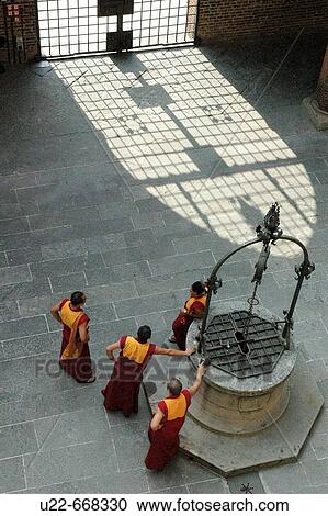 Bologna (Italy), Tibetan monks at Palazzo Re Enzo's cloister View Large Photo Image Stock Image - Bologna (Italy), Tibetan monks at Palazzo Re Enzo's cloister. Fotosearch