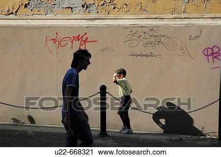 Stock Image - Bologna (Italy), walking in the historical centre. Fotosearch