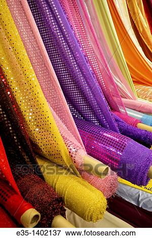Bolts of colored fabric at a fabric shop in Pezenas, France View Large Photo Image Stock Photo - Bolts of colored fabric at a fabric shop in Pezenas, France. Fotosearch
