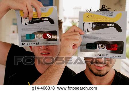 Stock Photo - Book Fair International, 3D glasses, giveaway, promotion, Sprint, NBC, Medium, tv series. Miami. Florida. USA.. Fotosearch