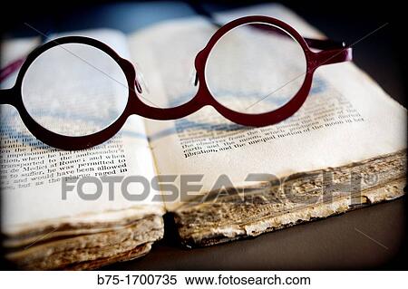 Book with glasses View Large Photo Image Stock Photography - Book with glasses. Fotosearch