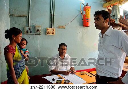 Stock Photograph - Bookkeeper with family in local canteen, Kolkata, India.. Fotosearch