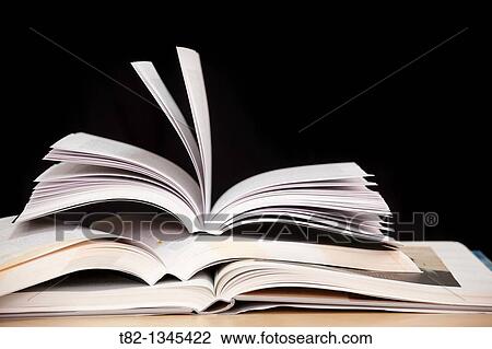books stacked on a black background View Large Photo Image Stock Image - books stacked on a black background. Fotosearch