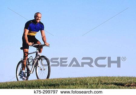 Stock Photo - boomer bicycling. Fotosearch