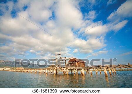 Stock Image - Booth nurseries or breeding of mussels in the Natural Park of Delta del Ebro. Fotosearch