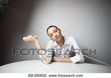 Bored Worker Office Woman playing with phone View Large Photo Image Stock Image - Bored Worker Office Woman playing with phone. Fotosearch