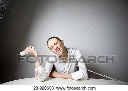 Bored Worker Office Woman playing with phone View Large Photo Image Stock Image - Bored Worker Office Woman playing with phone. Fotosearch