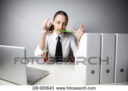 Bored Worker Office Woman playing with pencil View Large Photo Image Stock Image - Bored Worker Office Woman playing with pencil. Fotosearch
