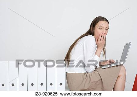 Stock Photography - Bored Worker Office Woman. Fotosearch