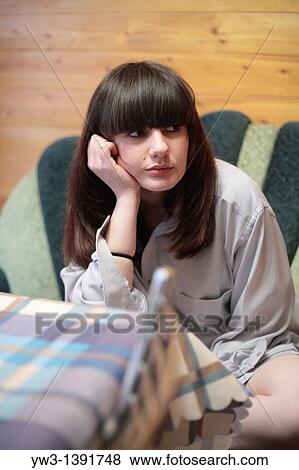 Bored young woman View Large Photo Image Stock Photo - Bored young woman. Fotosearch