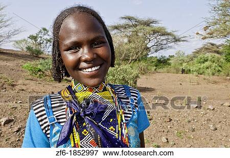 Stock Photo - Borena tribe Ethiopia Africa Lower Omo Valley young girl in bright colorful outfit 28. Fotosearch