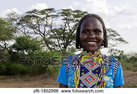 Borena tribe Ethiopia Africa Lower Omo Valley young girl in bright colorful outfit 28 View Large Photo Image Stock Photograph - Borena tribe Ethiopia Africa Lower Omo Valley young girl in bright colorful outfit 28. Fotosearch