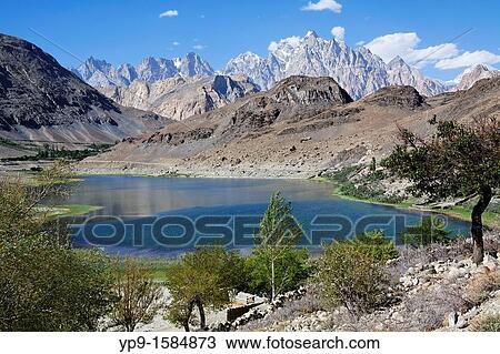 Stock Image - Borith Lake and mountains, Passu, Hunza Valley, Karakorum, Pakistan. Fotosearch