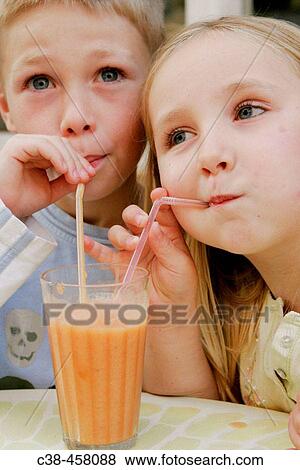 Bothers Sharing a Fresh Juice View Large Photo Image Stock Photo - Bothers Sharing a Fresh Juice. Fotosearch