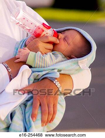Stock Photo - bottle feeding. Fotosearch